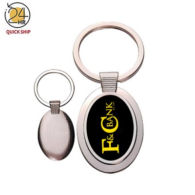 Oval metal key chain with dark reflective center